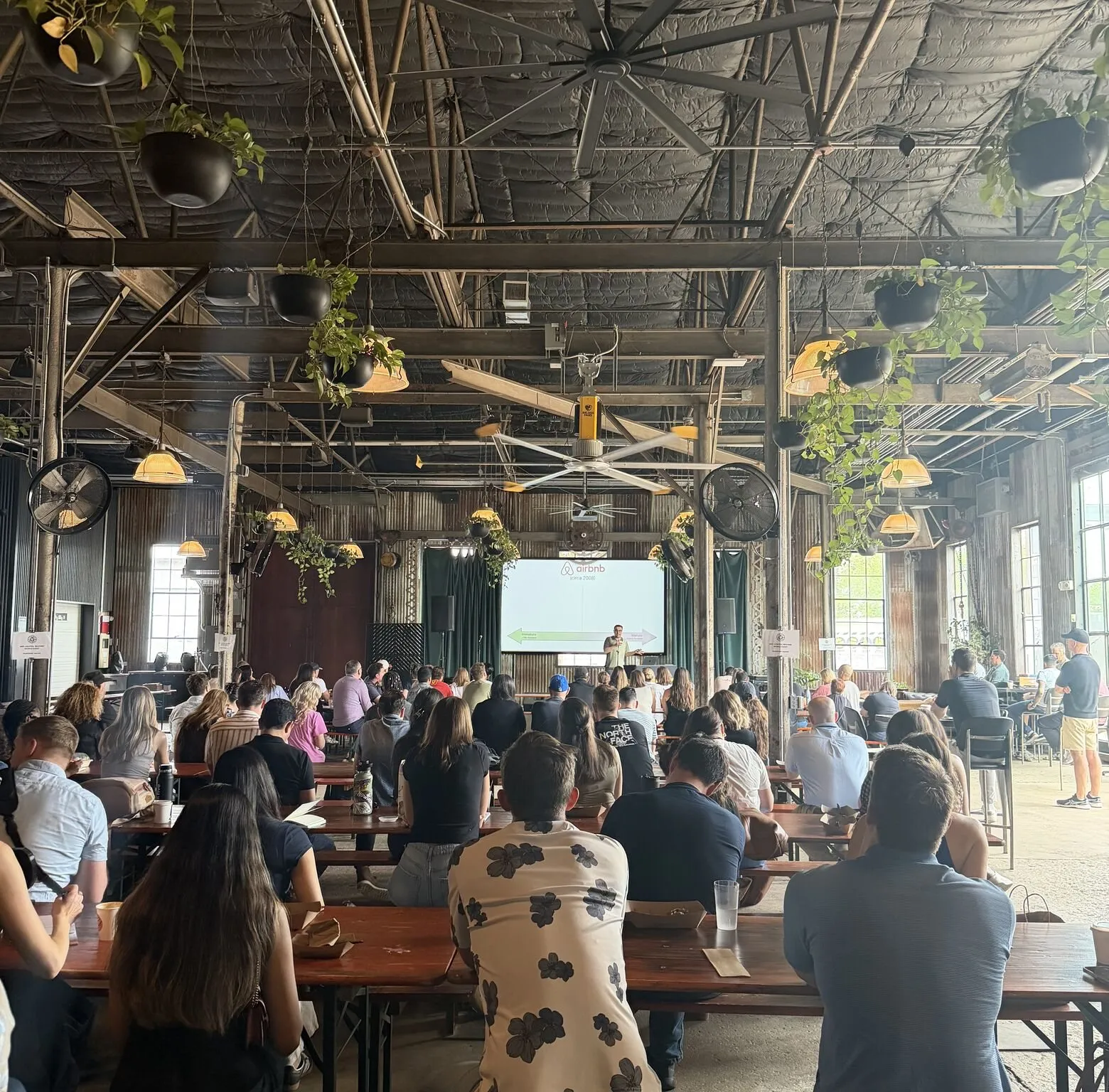 Moby giving a talk to a full room